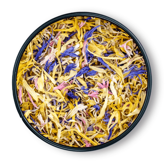 Bio Blütenmix in runder Dosis: getrocknete gelbe, lila und rosa essbare Blütenblätter.