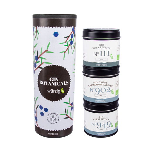 Bio Gin Botanicals würzig, daneben Dosen mit Rosa Pfeffer und Grünem Kardamom.