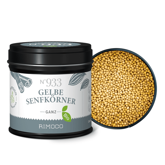 Offene Dose mit Bio Gelbe Senfkörner ganz, darin sichtbare ganze gelbe Senfkörner.