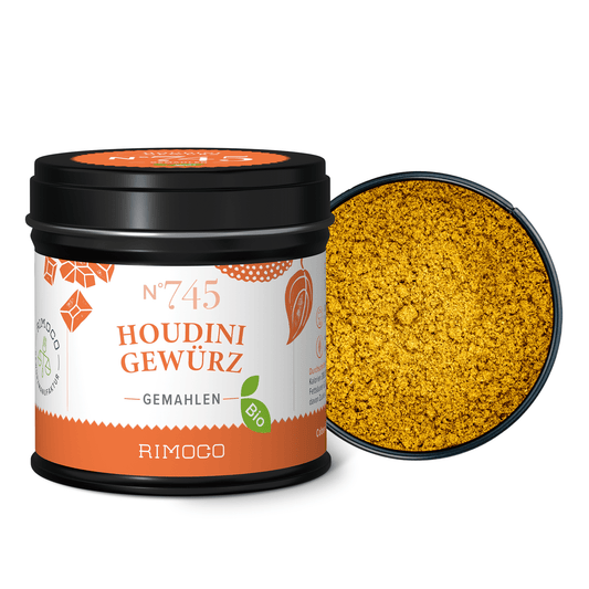 Schwarze Dose Bio Houdini Gewürz mit gemahlenem gelbem Gewürz.