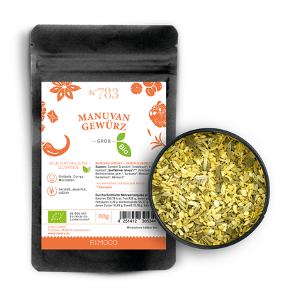 Schwarzer Bio Manuvan Gewürzbeutel neben einer Schale mit gemischtem, aromatischem Gewürz.