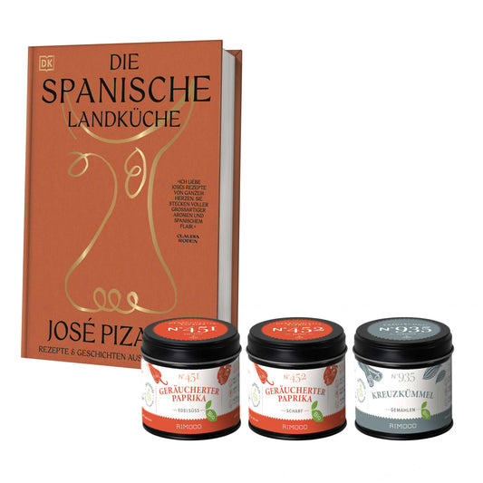 Spanisches Kochbuch und drei Gewürzgläser mit gemahlenem, geräuchertem Paprika sichtbar.