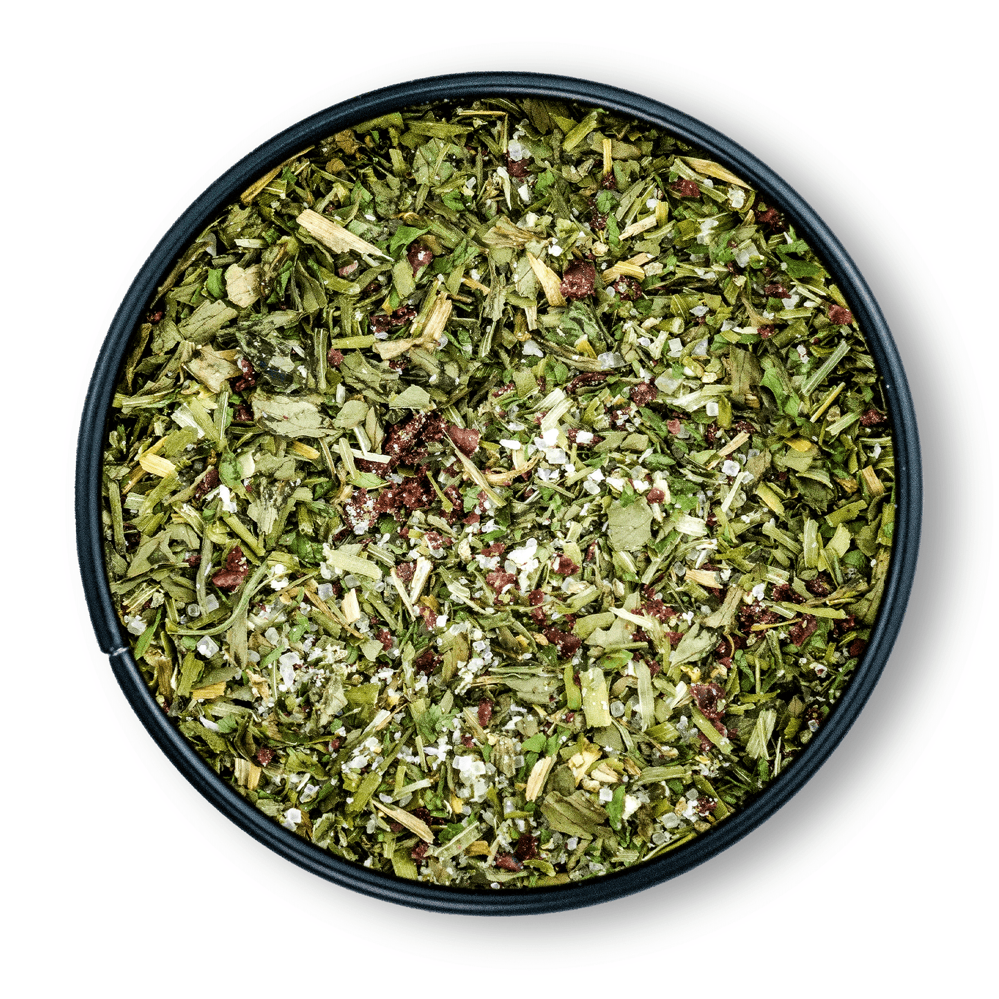 Runde Dosis Bio Salatgewürz mit grünem, getrocknetem Kräuter-Gewürz-Mix von oben gesehen.