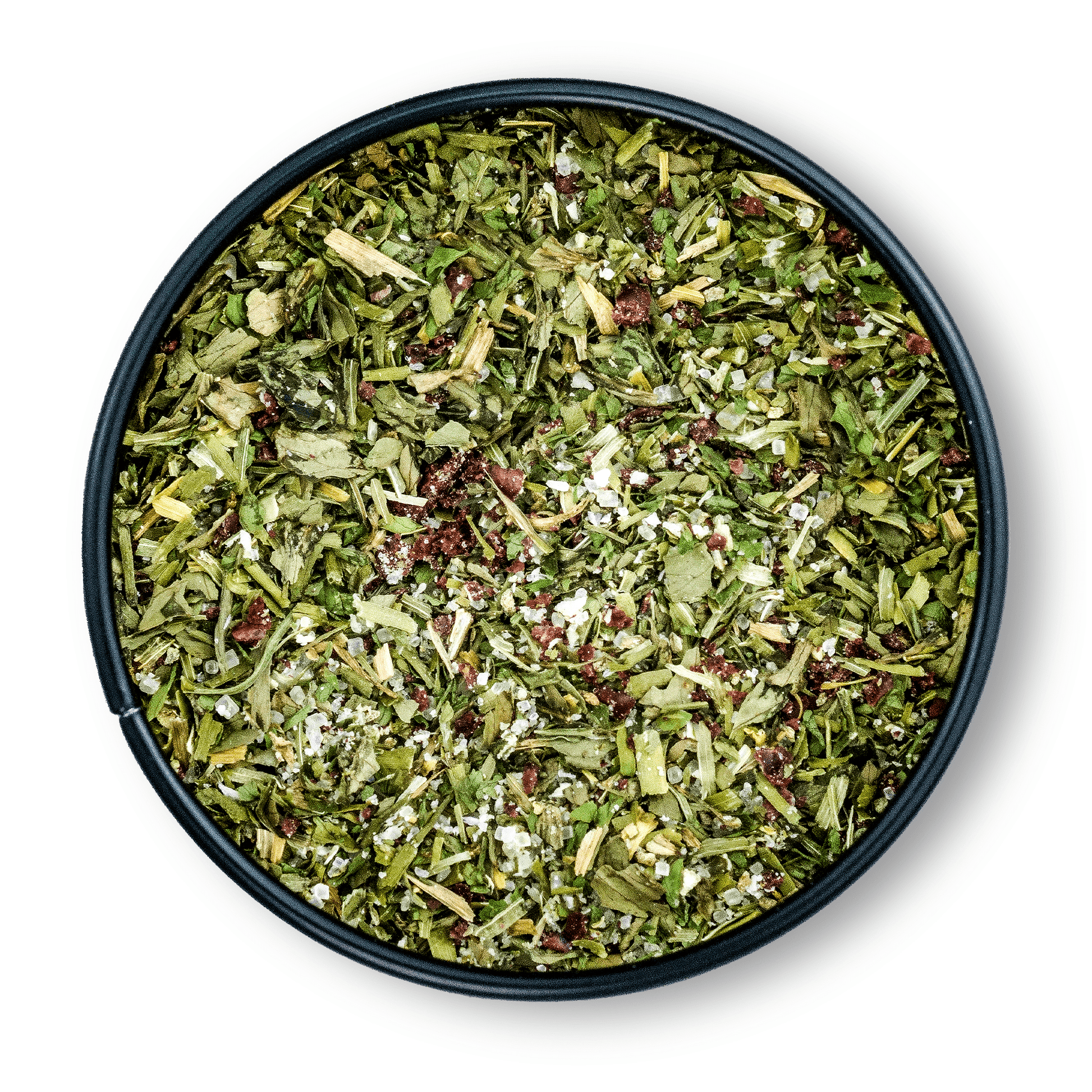 Runde Dosis Bio Salatgewürz mit grünem, getrocknetem Kräuter-Gewürz-Mix von oben gesehen.