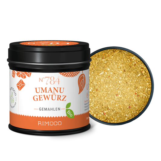 Offene Dose mit Bio Umanu Gewürz, gelbes, gemahlenes Gewürz ist sichtbar.